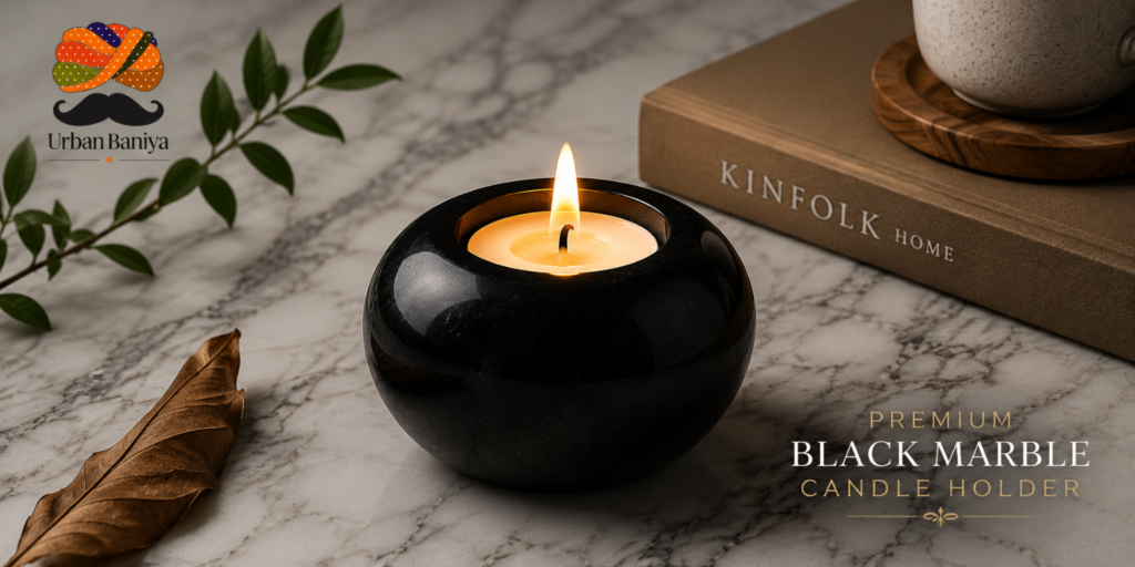 Premium black marble candle holder with a lit candle on a marble surface, featuring Urban Baniya branding and elegant home decor styling.